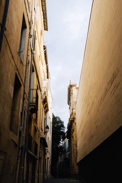 Buildings Walls around Narrow Alley in Town