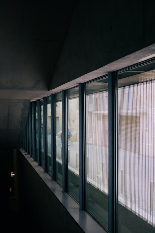 Windows in Darkness in Corridor with Street behind