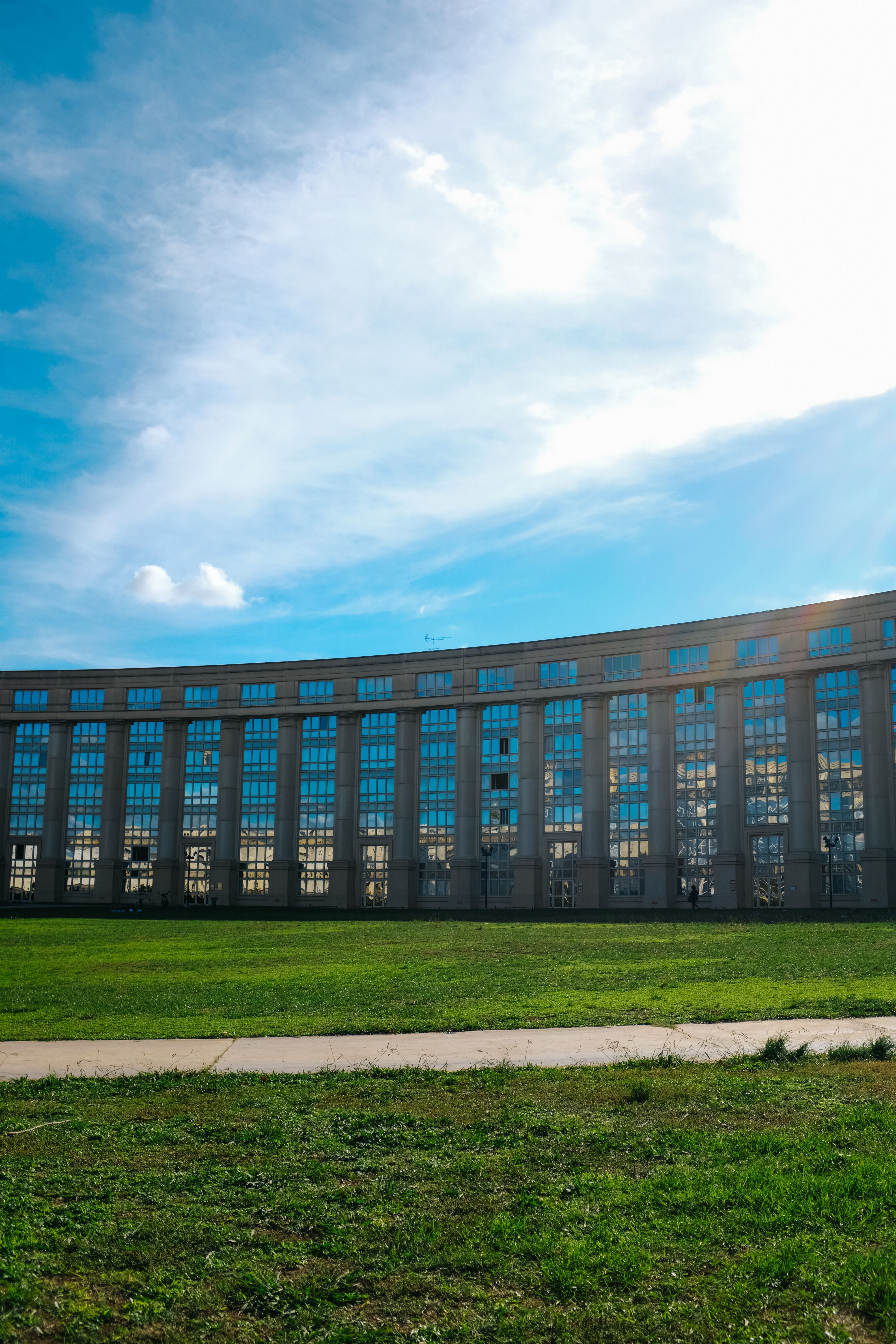 Grass, Sidewalk and Residential Building behind · Free Stock Photo
