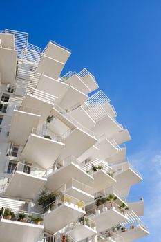 Explore the stunning balconies of L'Arbre Blanc, a landmark in Montpellier, France.