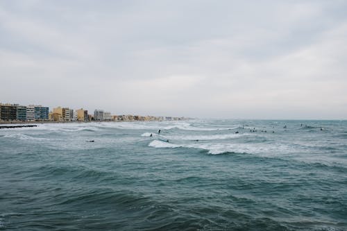 View of a Sea and Buildings on the Coast 