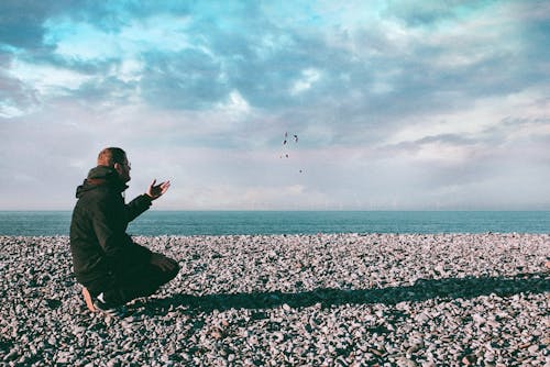 Man Throwing Stones