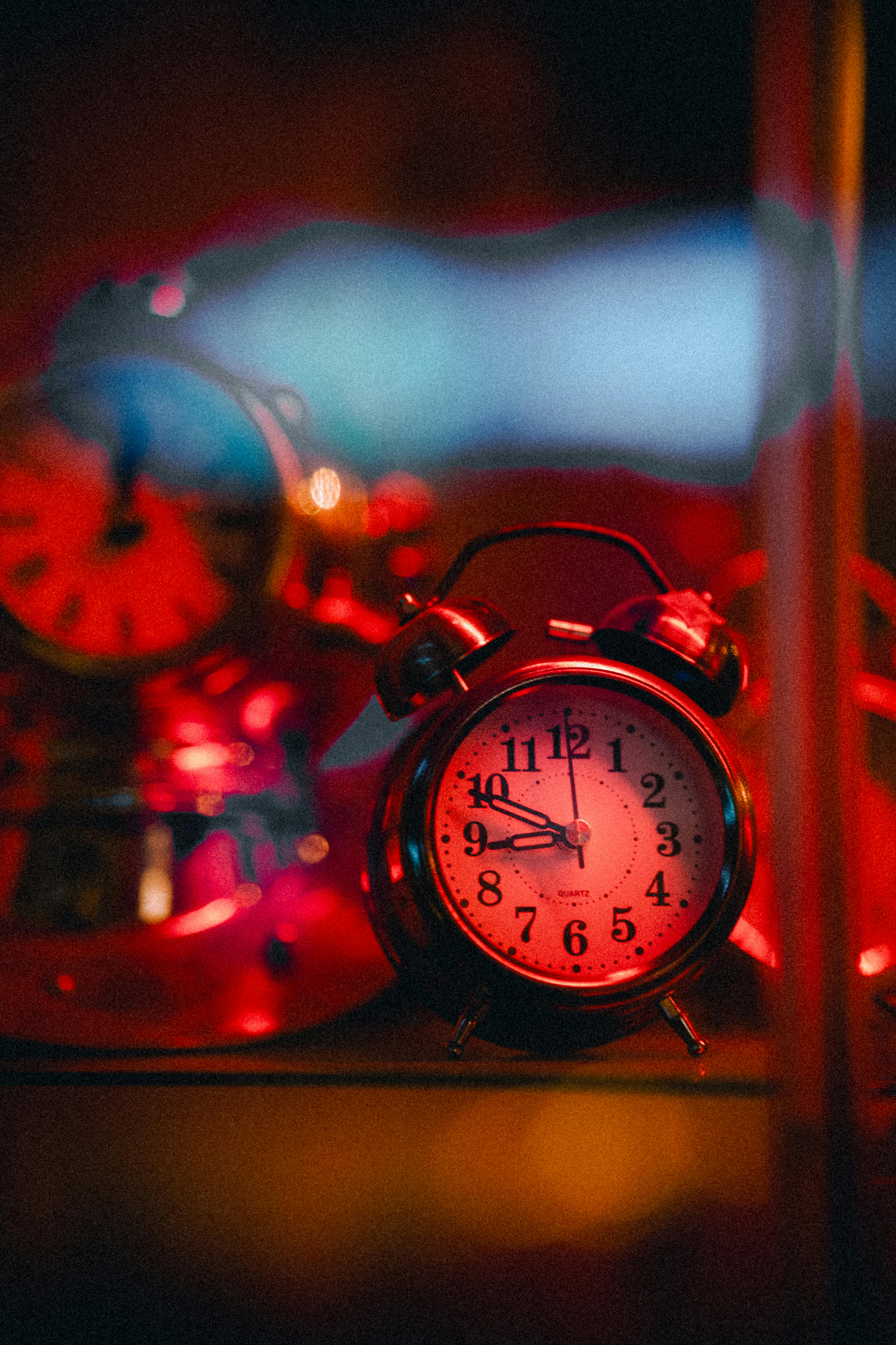 Alarm Clocks in Red Light · Free Stock Photo