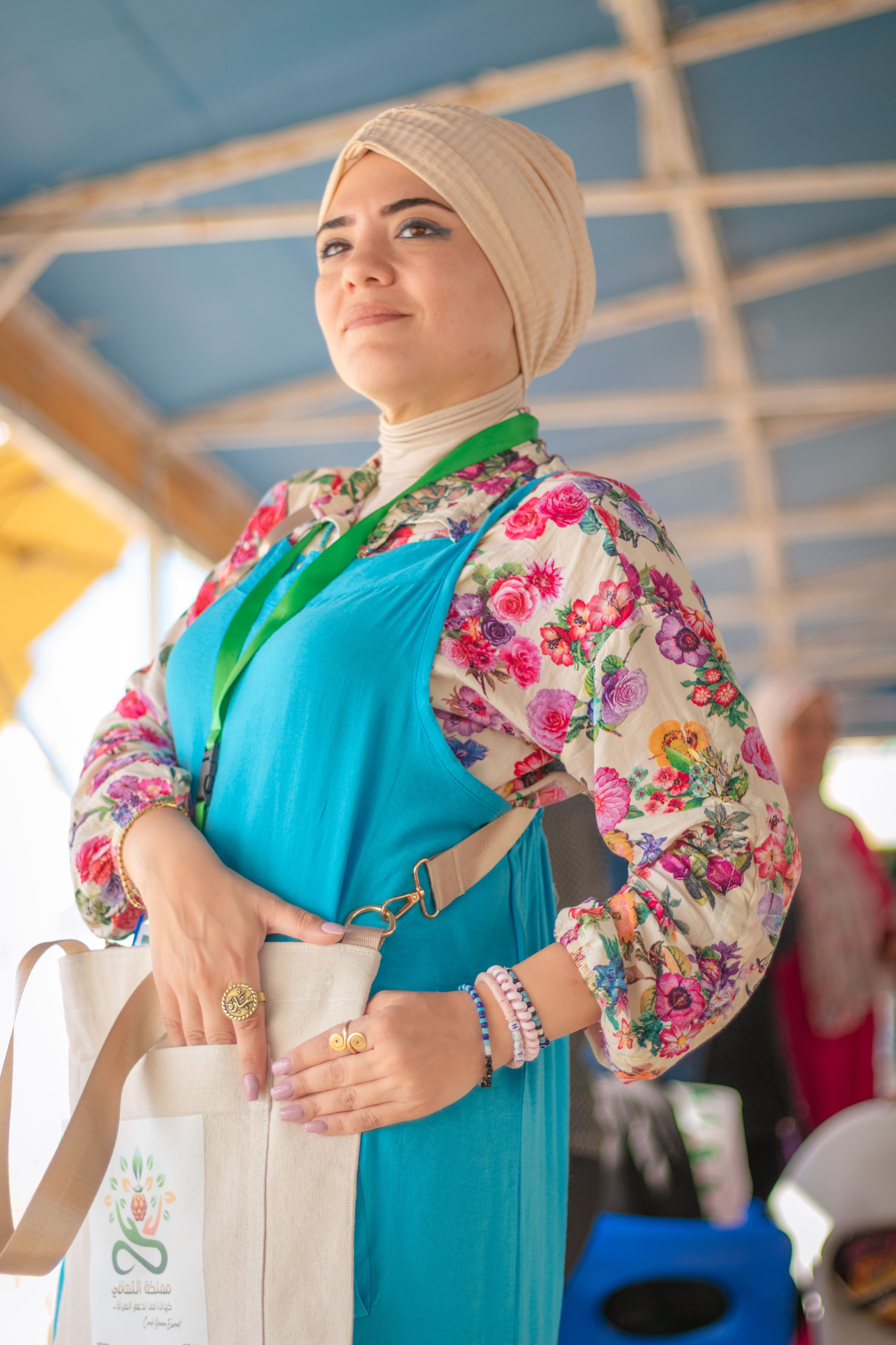 Woman in Dress and Gown Posing with Shopping Bag