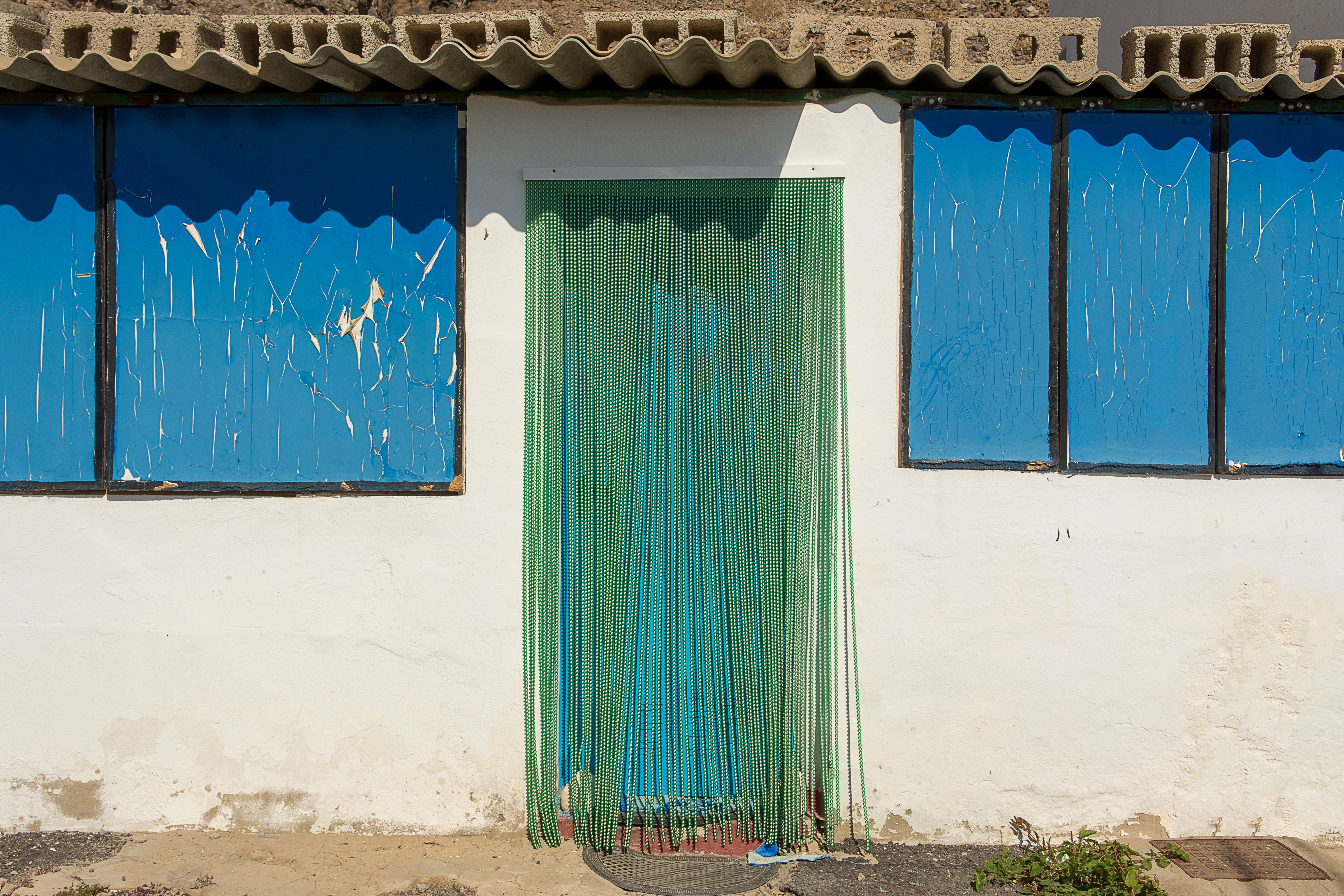 Exterior of a Building with Beads Hanging in the Doorway · Free Stock Photo
