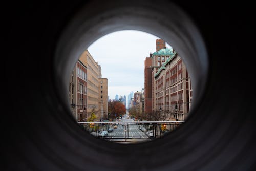 A Street and Buildings in City Photographed through w Hole 