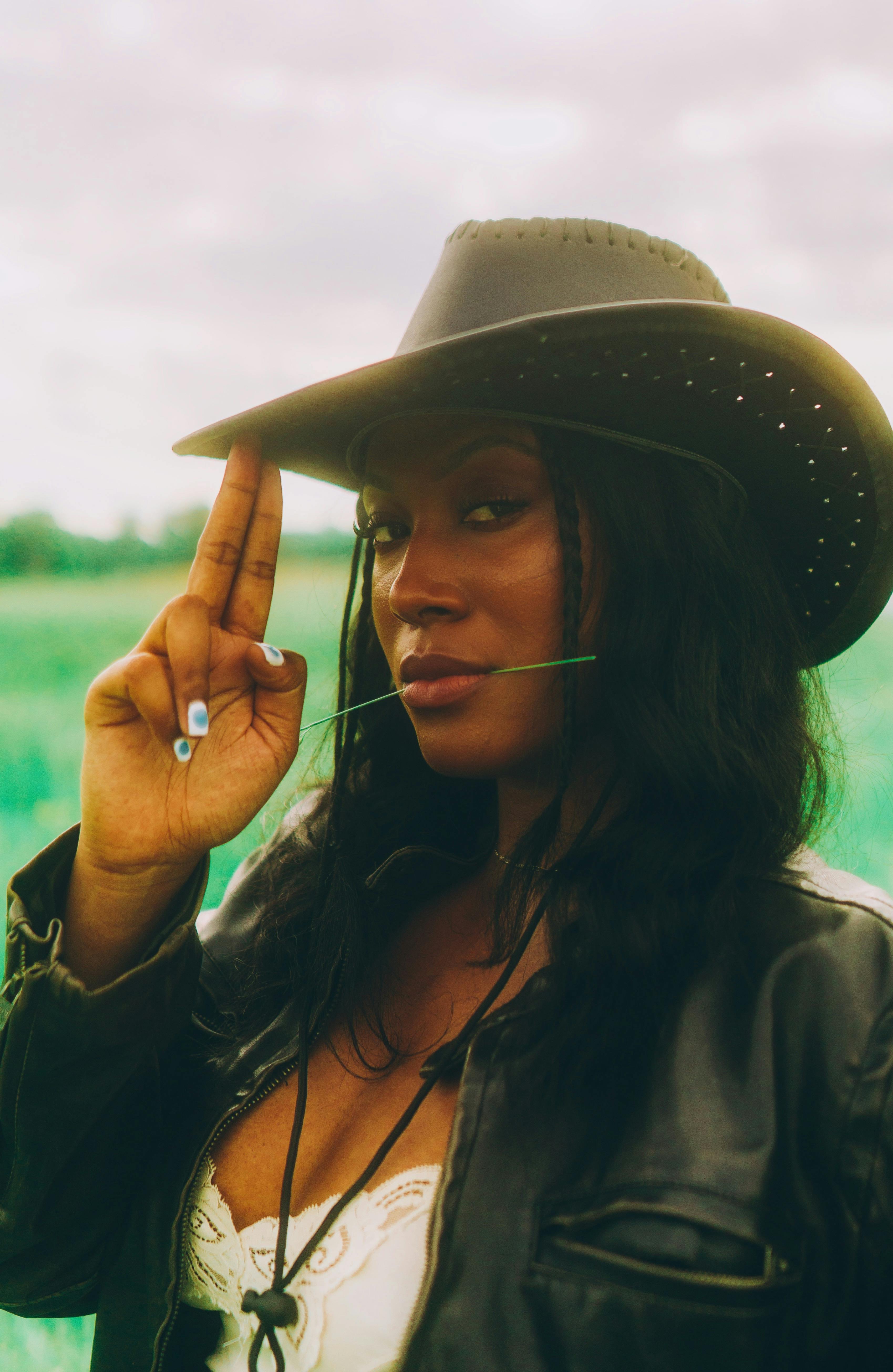 cowgirl with straw in mouth