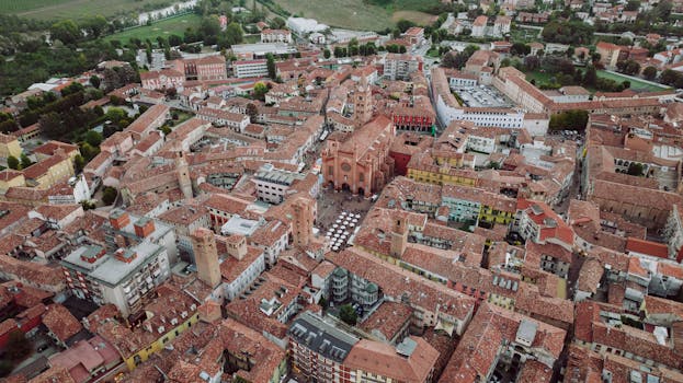 Discover Alba's charming old town from above, showcasing historic buildings and vibrant architecture.