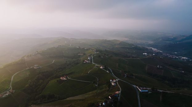 Stunning aerial view of Alba's rural landscape in Piemonte, Italy at sunset.