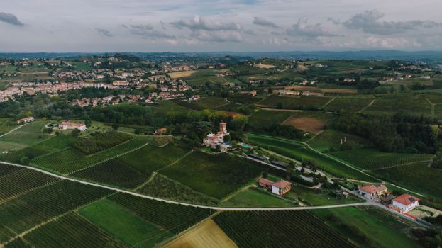 Breathtaking aerial view of the lush vineyards and countryside of Costigliole d'Asti, Piedmont, Italy.