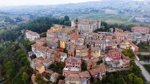 A picturesque aerial view of Costigliole d'Asti showcasing historic buildings and lush landscapes.