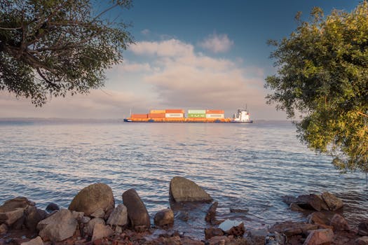 Container ship on tranquil morning waters in Porto Alegre, Brazil.