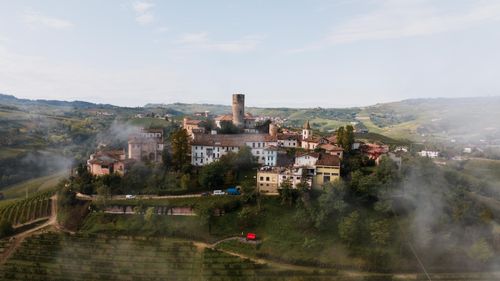 Free A scenic aerial shot of Castiglione Falletto, Italy, showcasing rustic architecture and lush vineyards. Stock Photo