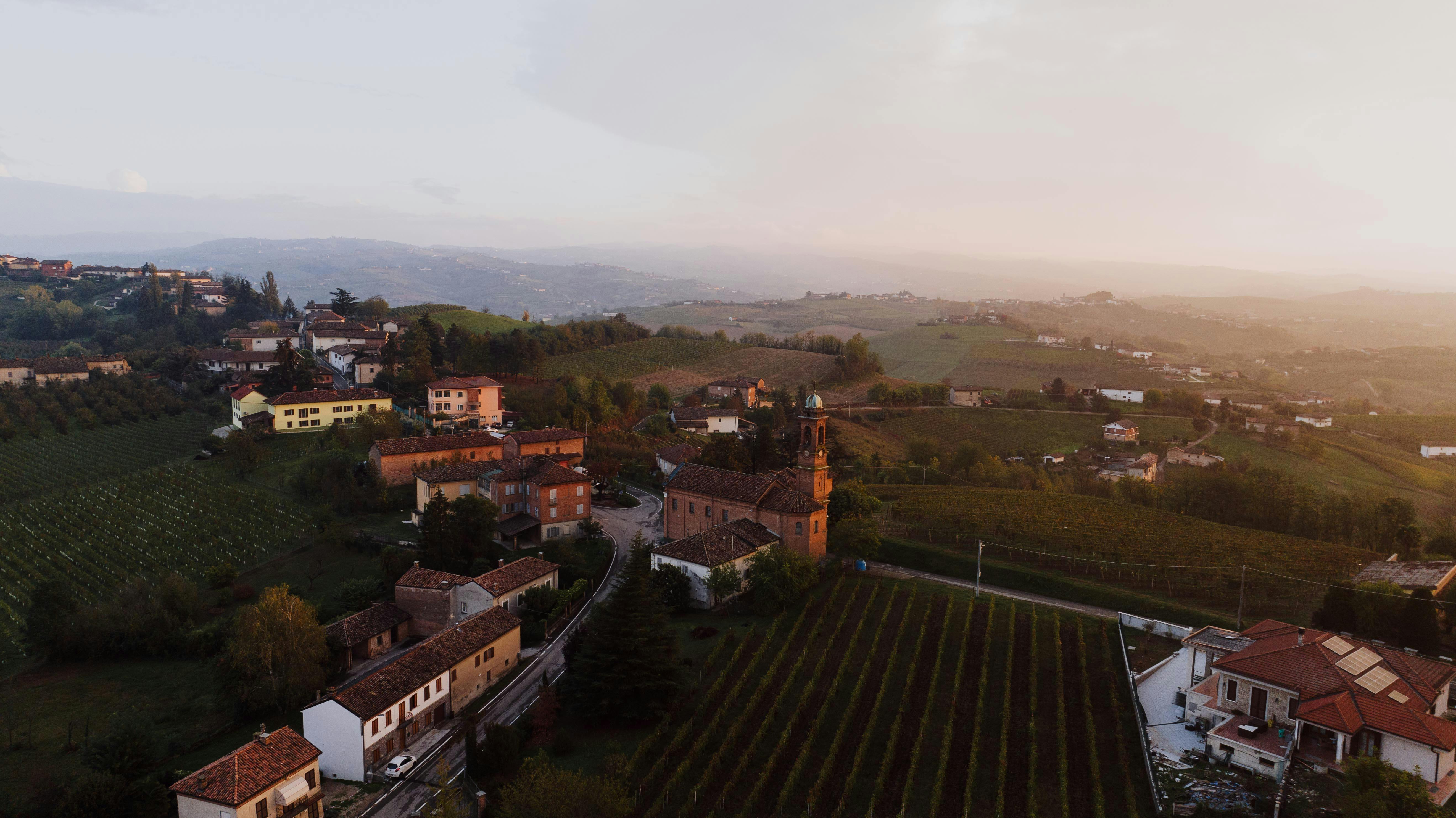 panoramic view of the Volta Region hills at sunset with a small church building in the distance