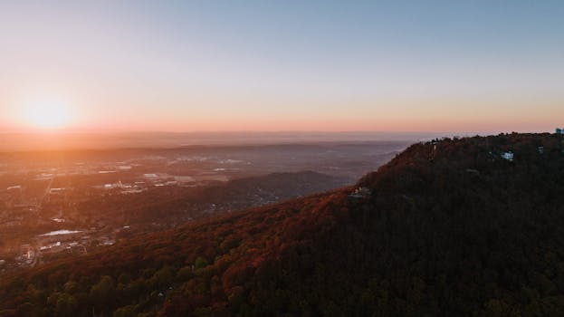 A stunning aerial view of a sunset illuminating the Chattanooga Valley with vibrant colors.
