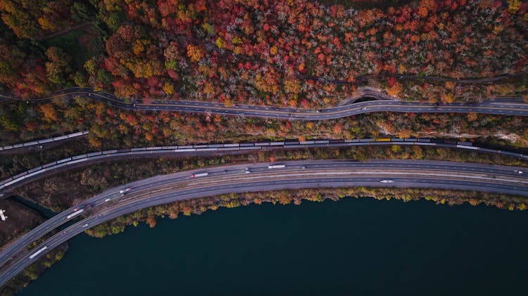 Roads And Railway Tracks Along Sea In Autumn