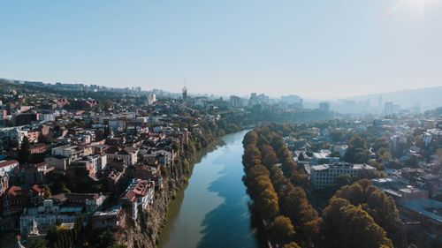 Free Discover the stunning cityscape of Tbilisi with the Kura River cutting through the vibrant landscape. Stock Photo