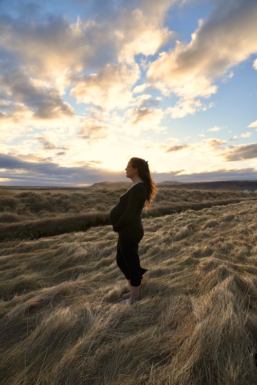 Woman on a Beach During Sunset