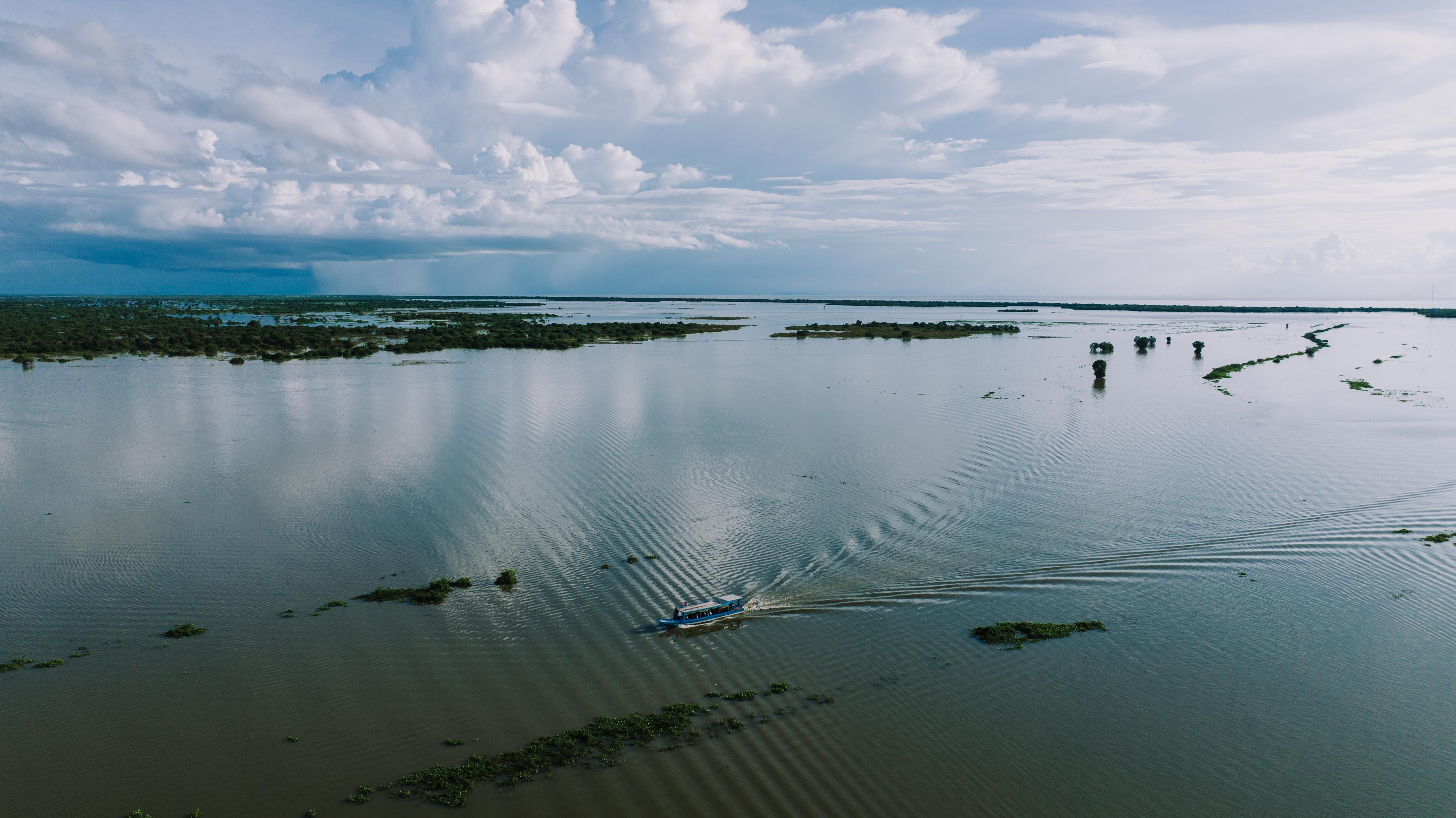 Aerial view of a serene lake in Kampong Khleang, Cambodia, showcasing natural beauty and tranquil scenery.