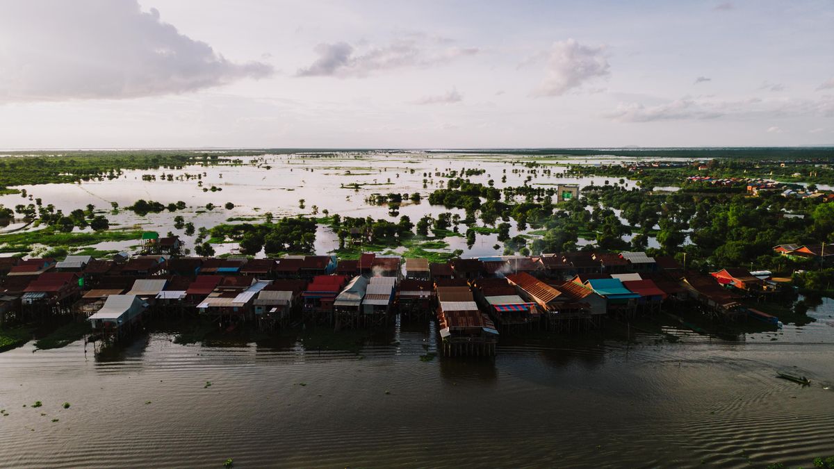 Boats and stilted houses on a lake in Cambodia