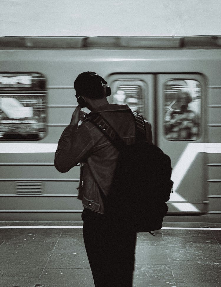 Man Wearing Backpack In A Metro Station 