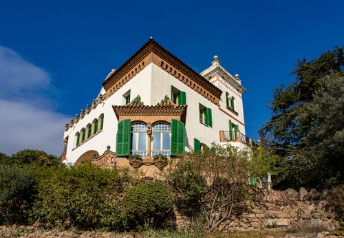 Free Beautiful Spanish villa with green shutters basking in sunlight, Barcelona. Stock Photo