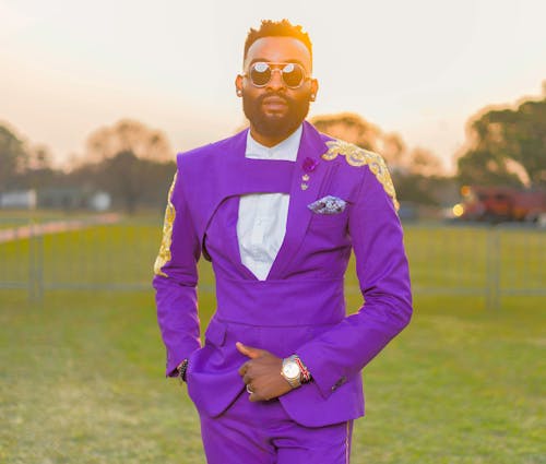 African Man Wearing Purple Suit in a Park