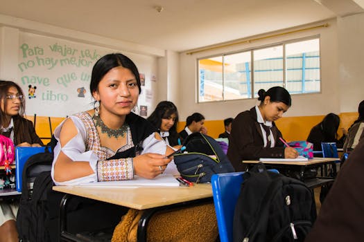 A group of students attentively studying in a classroom, showcasing a lively educational environment.