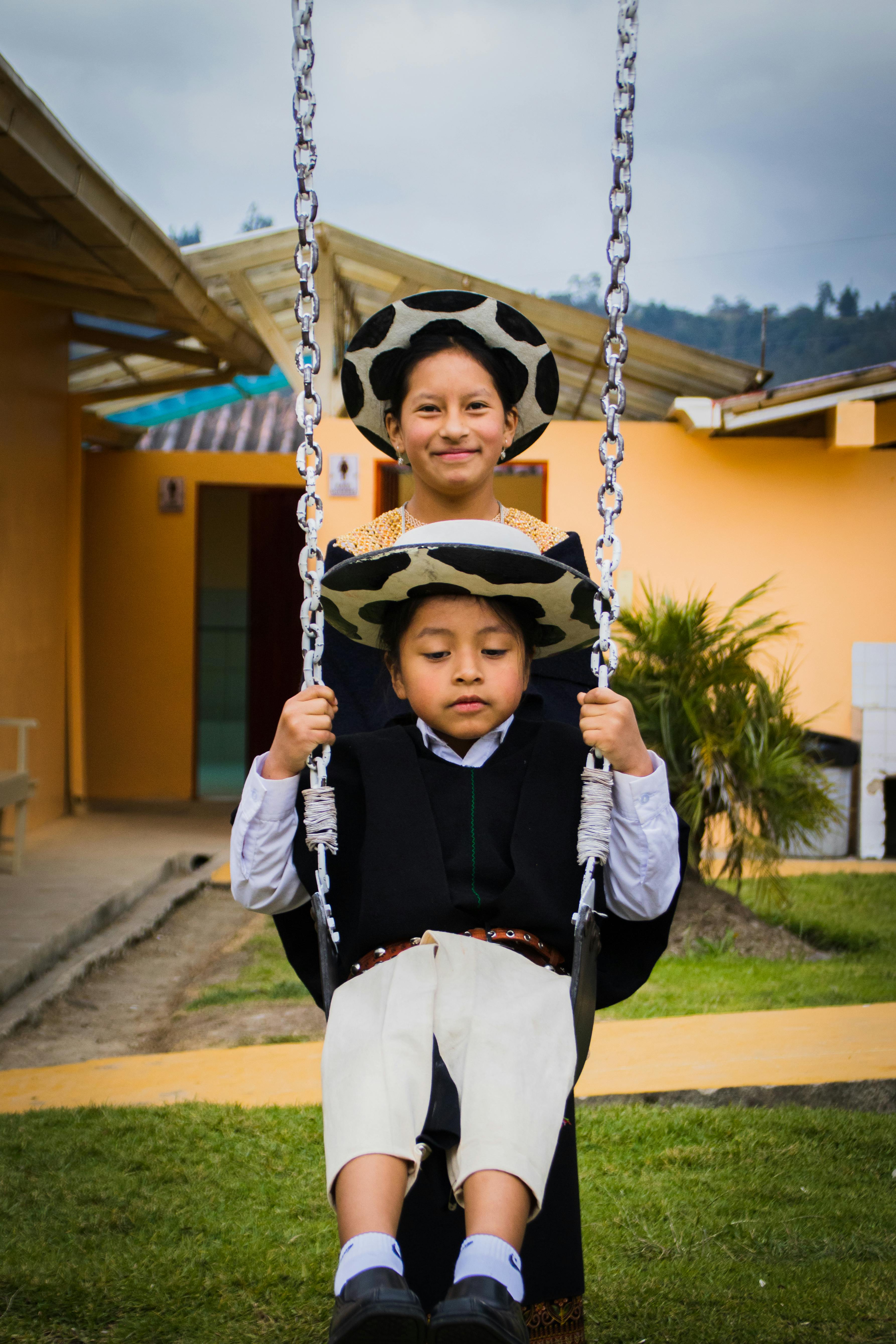 smiling mother and son on swing