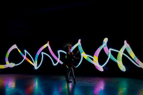 Free Colorful dance performance with Catrina theme and vibrant light trails in Mexico. Stock Photo