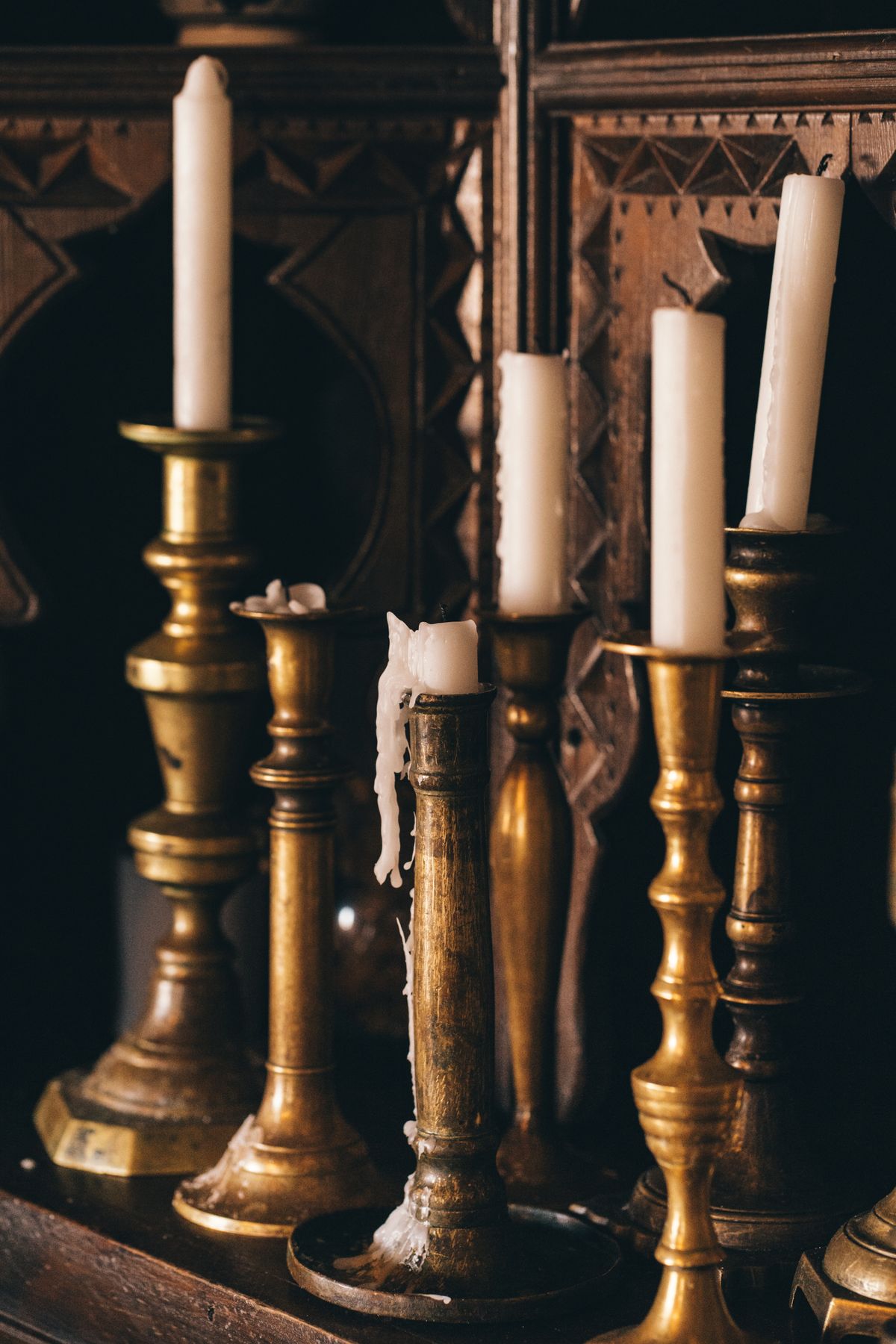 Vintage brass candlesticks with white taper candles
