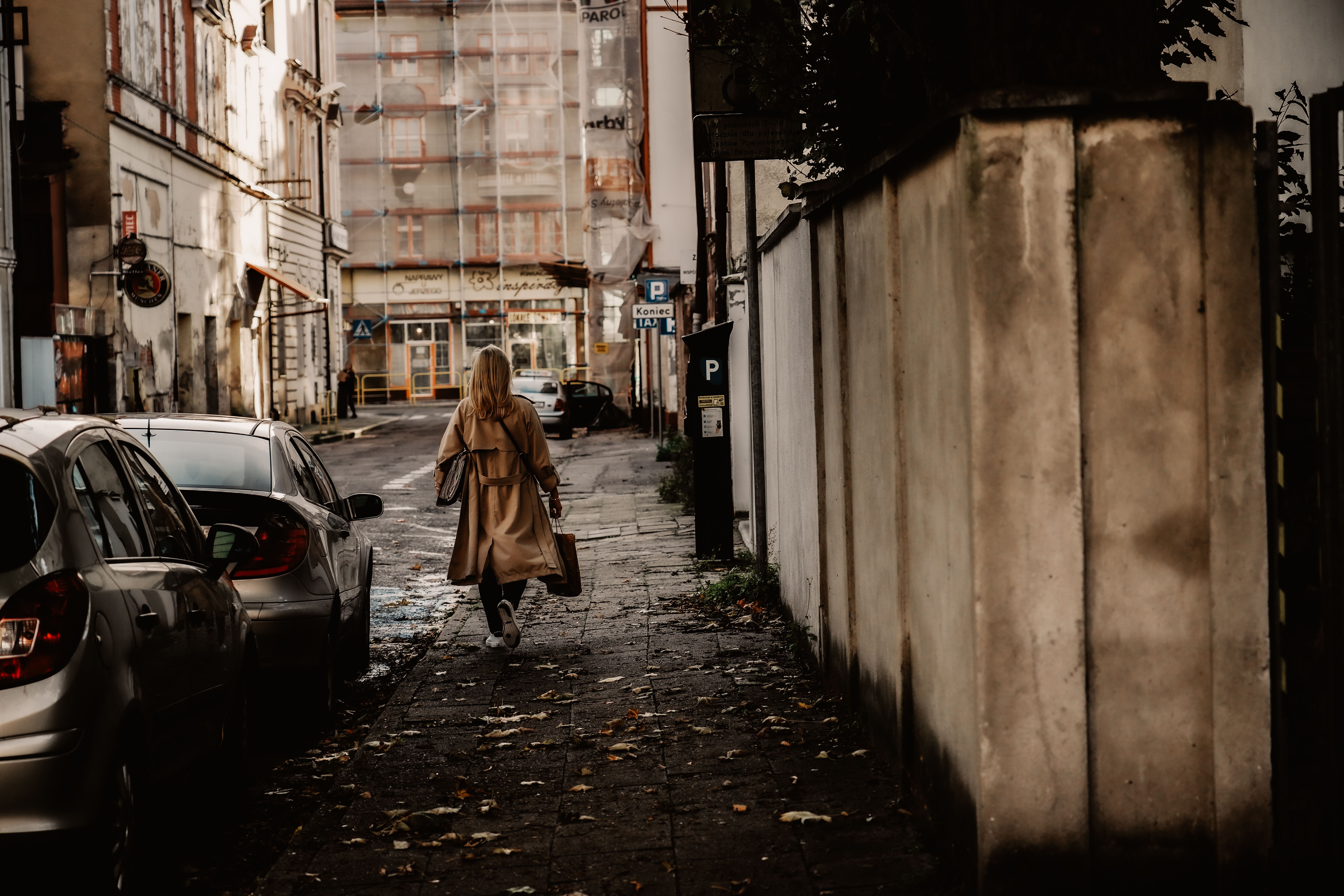 Woman Wearing Coat Walking on a Street · Free Stock Photo