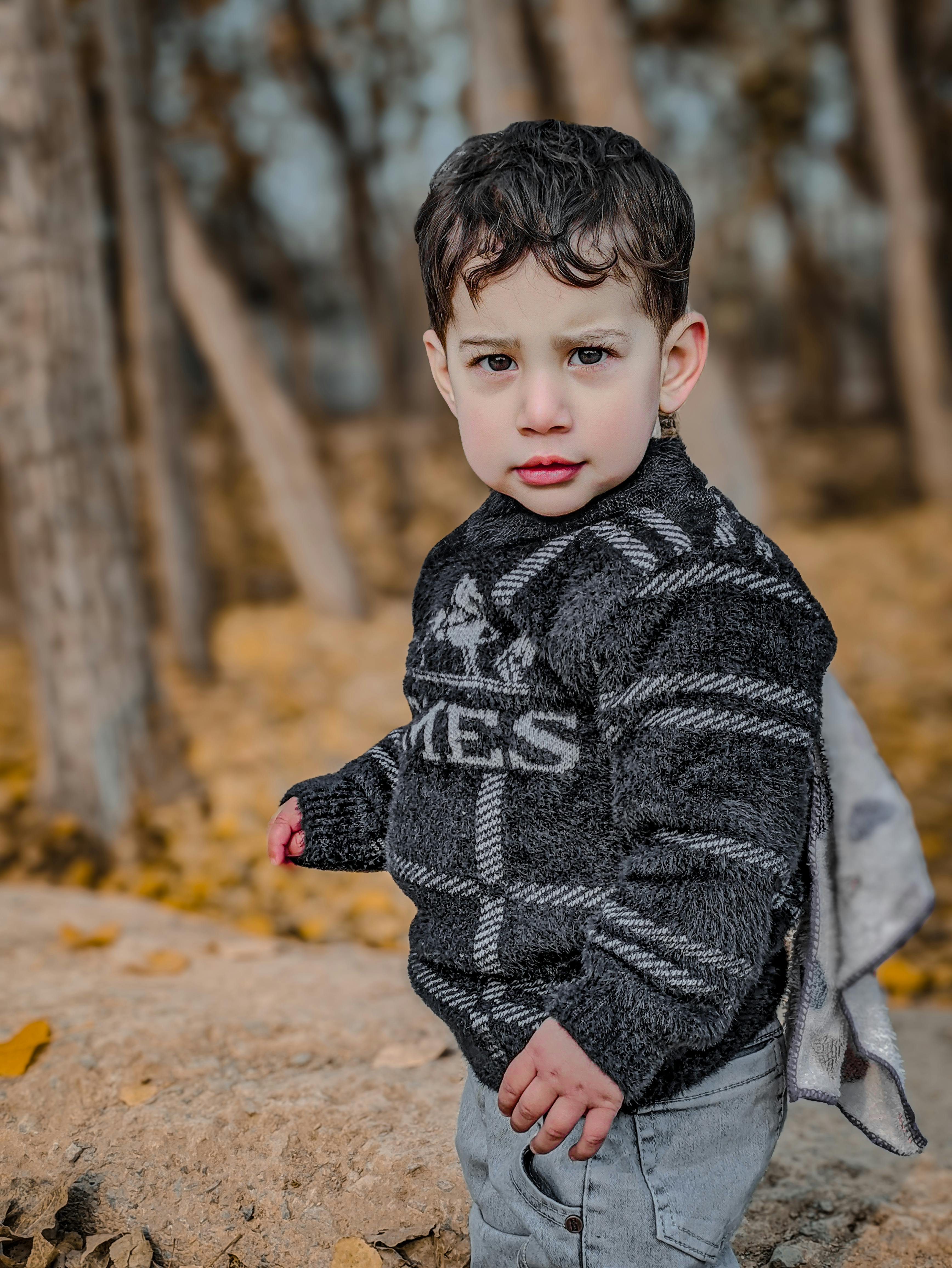 little boy in a forest