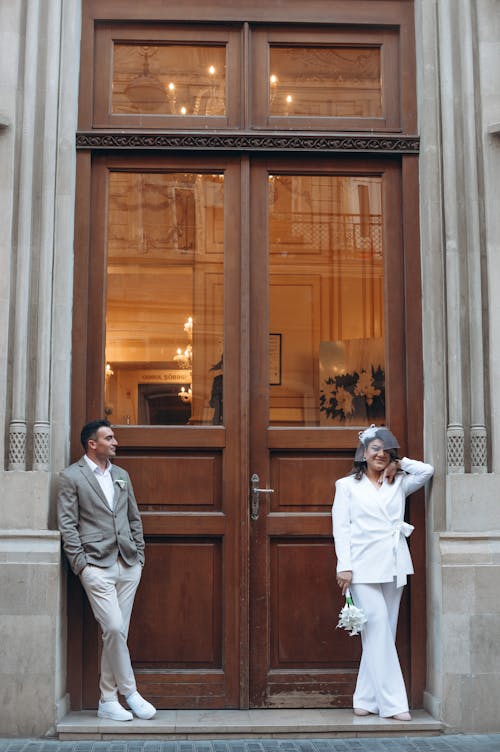Elegant Couple in Front of Entrance 