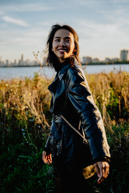 A Smiling Woman in a Leather Jacket