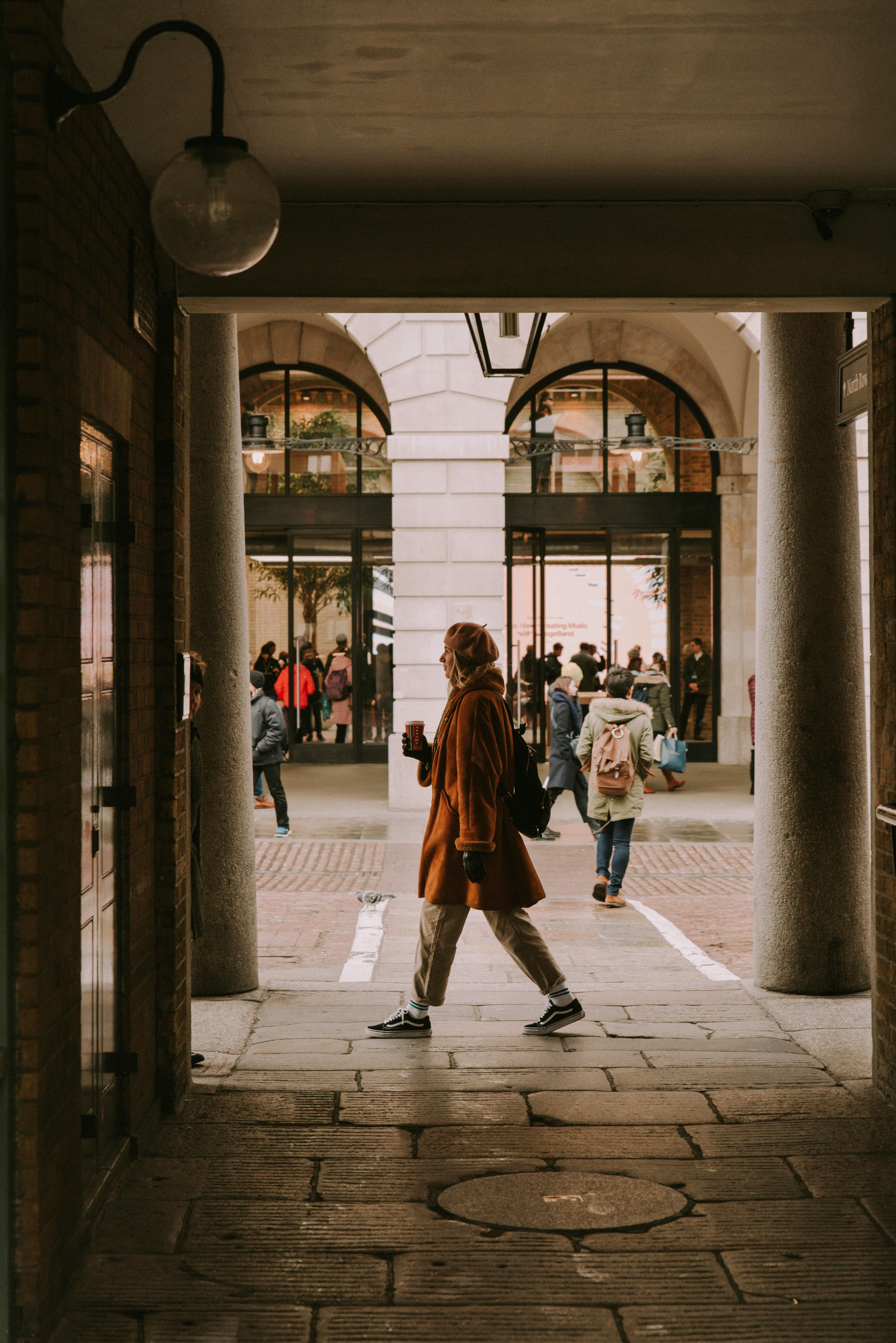 woman walking through building