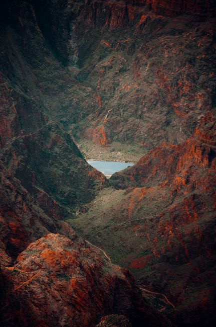 A breathtaking aerial view captures the rugged textures of an isolated canyon.