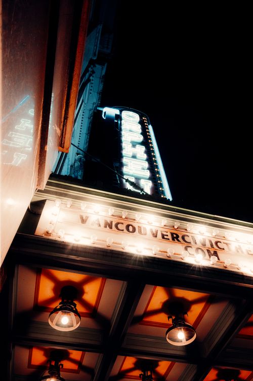 Free Dramatic low angle view of an illuminated theater sign on a Vancouver street at night. Stock Photo