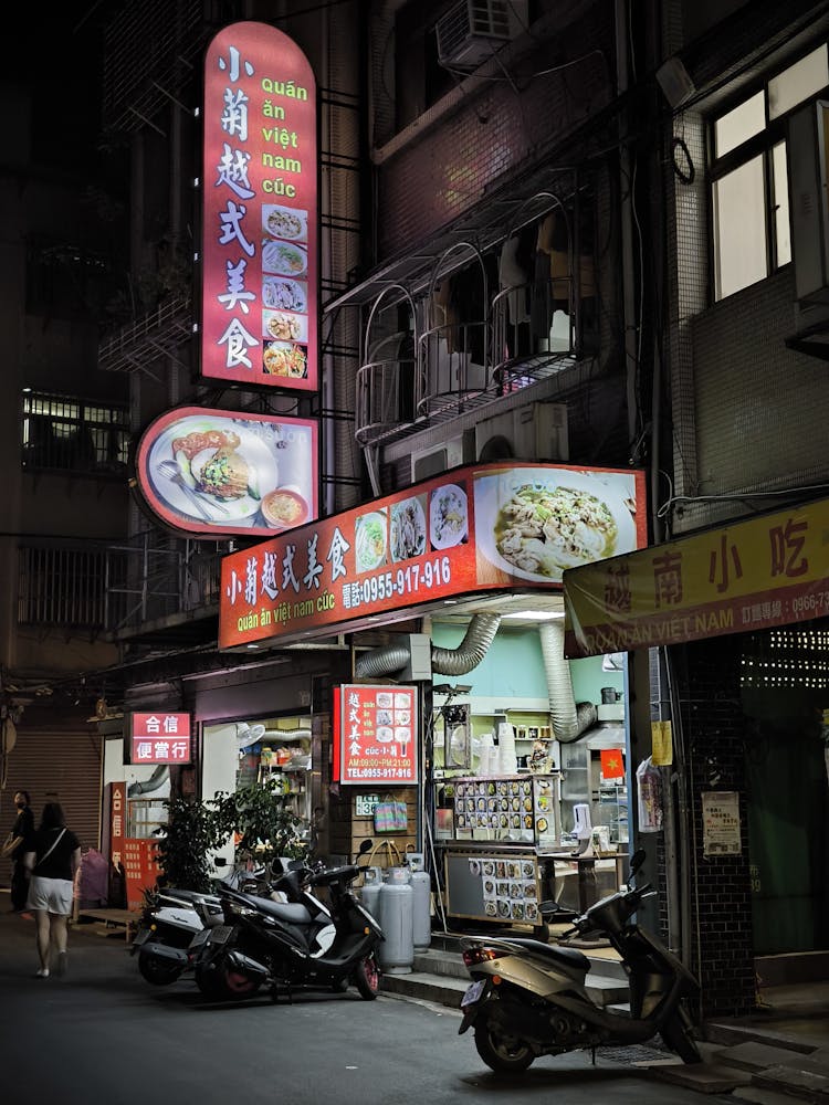 Souvenir Shop By The Street At Night 