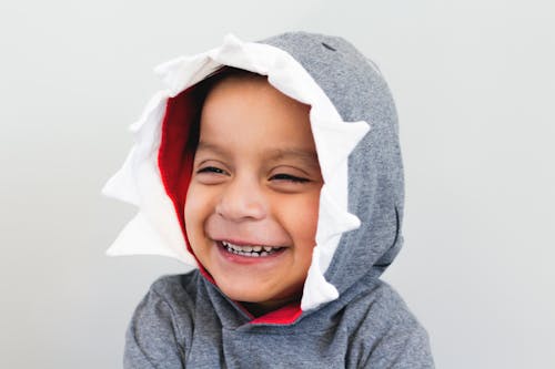 Free Boy Smiling Wearing Grey And White Hooded Top Stock Photo