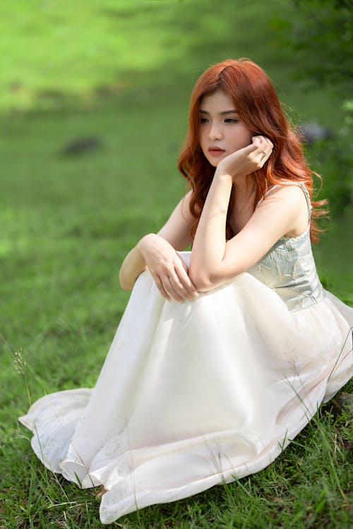 Woman Wearing White Dress in a Park
