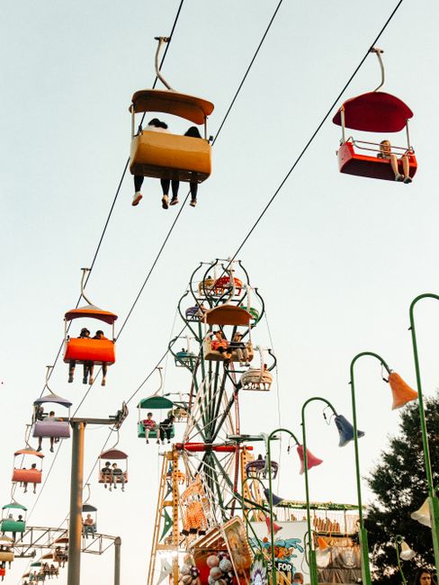 Enjoy a joyful day at an Atlanta amusement park with colorful cable cars and thrilling rides.