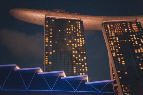 Free A stunning view of Marina Bay Sands in Singapore, illuminated against the night sky. Stock Photo