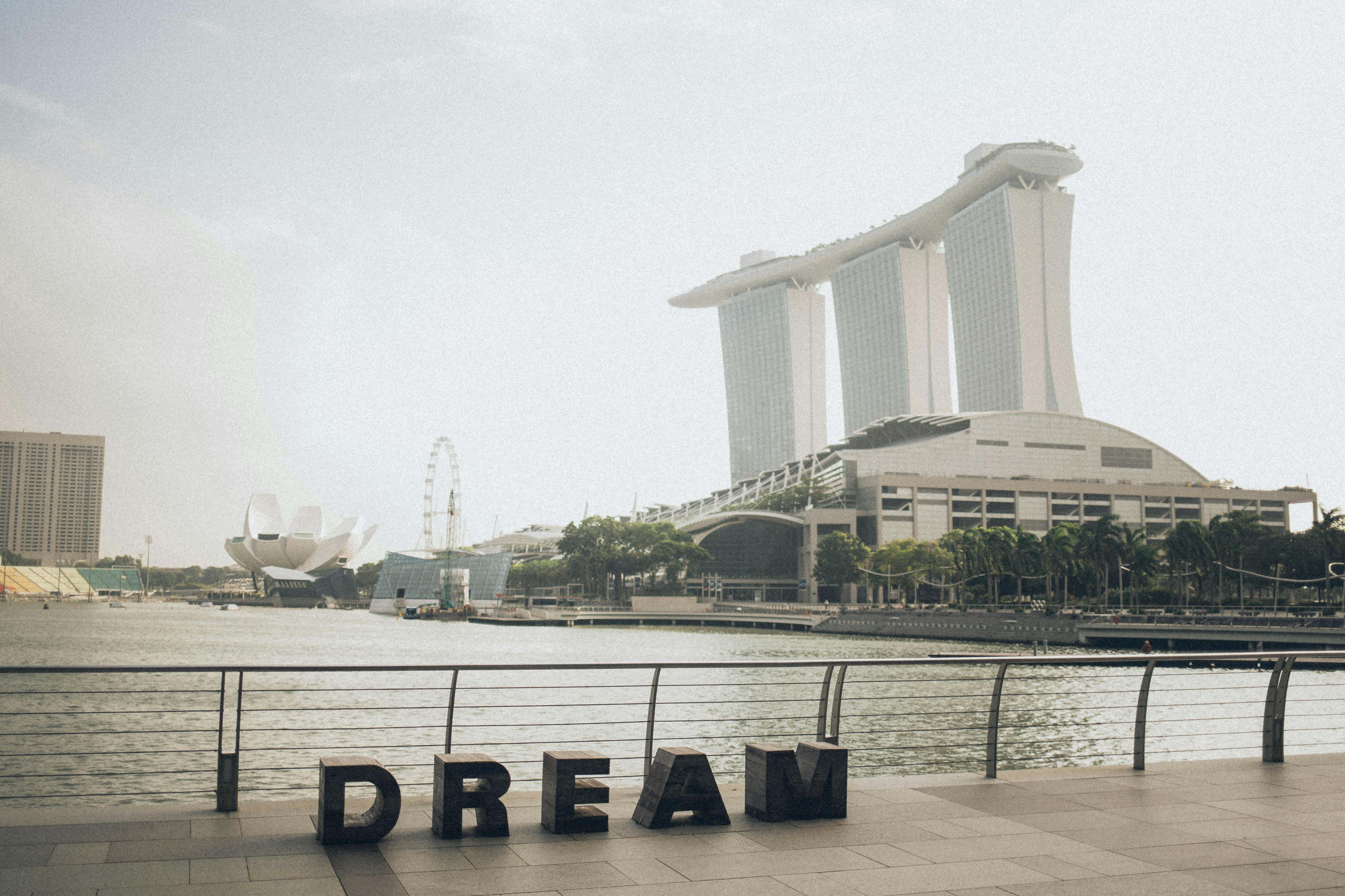 dream lettering near fence overlooking marina bay sands building