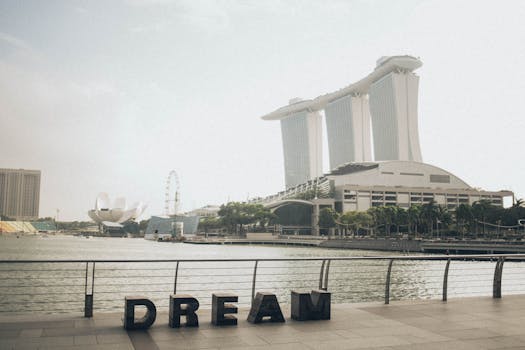 Scenic view of Marina Bay Sands with 'Dream' sculpture at Singapore waterfront.