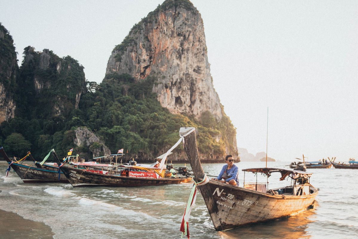 Railay Beach limestone cliffs and longtail boats