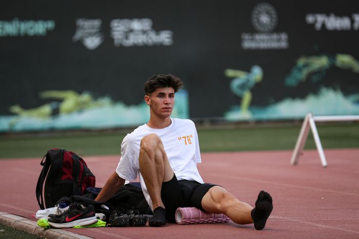 Athlete working on leg recovery, used as a placeholder for overuse injury support