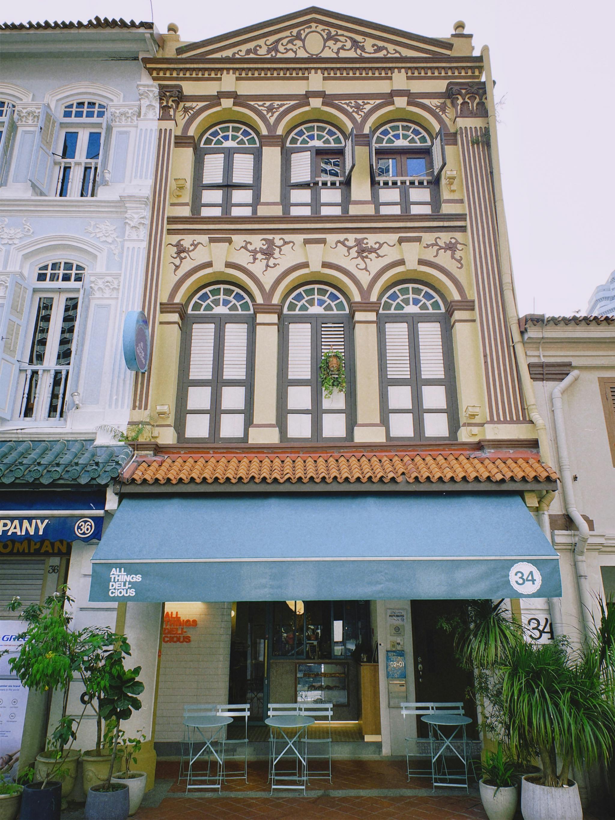Art deco walk-up apartments and a sidewalk café in Tiong Bahru neighbourhood Singapore