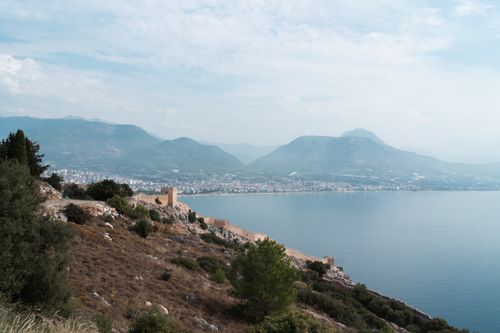 Free A stunning view of Alanya Castle with the sea and mountains in the background, Turkey. Stock Photo