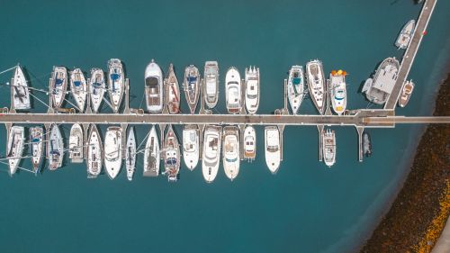 Free Aerial view of various boats moored at a marina in Saint-Malo, France, showcasing nautical serenity. Stock Photo